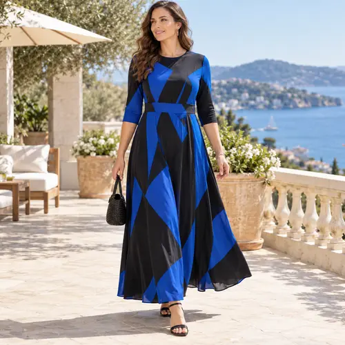 Royal blue and black geometric colour-block maxi dress with three-quarter sleeves, terrace setting